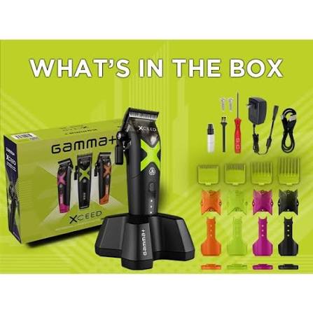 Gamma+ XSeed cordless hair clippers set displayed with its retail box, charging stand, and multiple colorful blade attachments on a bright lime green background with the text 'WHAT'S IN THE BOX'.